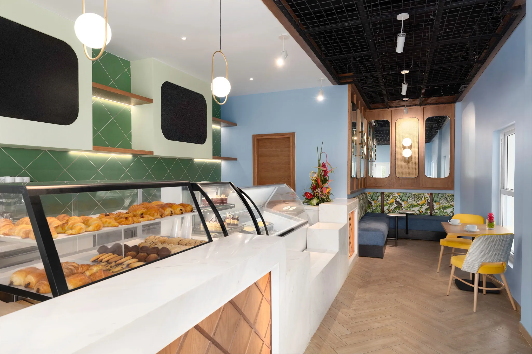 Coco Café at Zoëtry Marigot Bay St. Lucia featuring a modern coffee bar, fresh pastries, and cozy indoor seating.