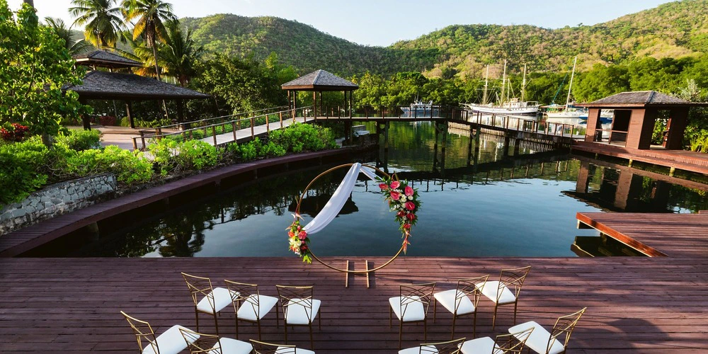 Cove Deck waterfront wedding ceremony setup overlooking Marigot Bay at Zoetry Marigot Bay St. Lucia