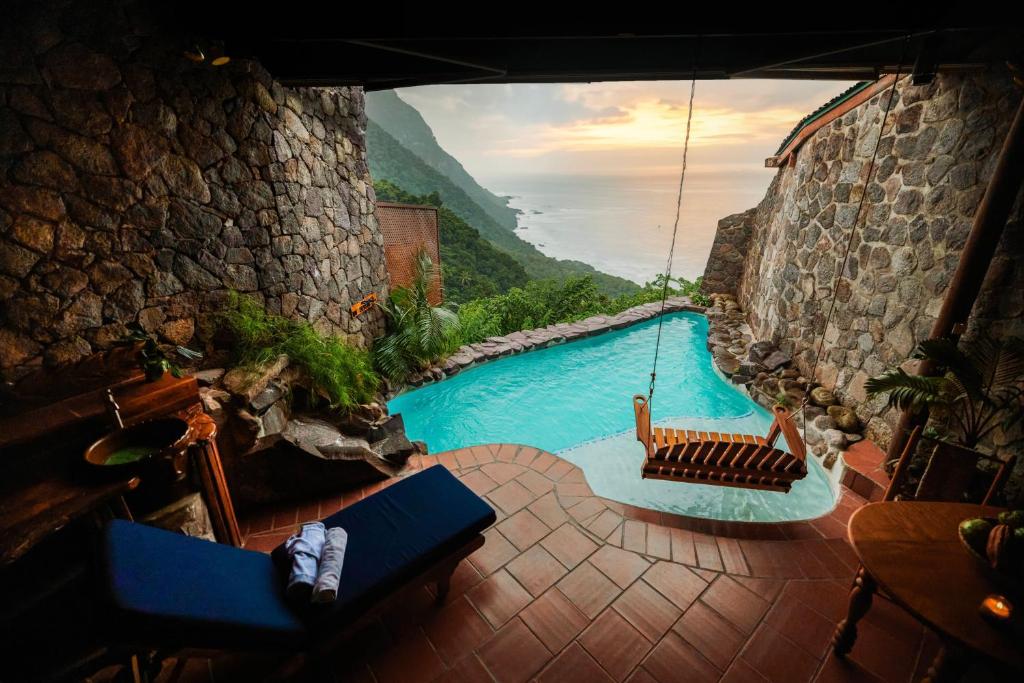 Ladera Resort St. Lucia luxury boutique hotel with open-air suites, Piton views, and rainforest setting in Soufrière.