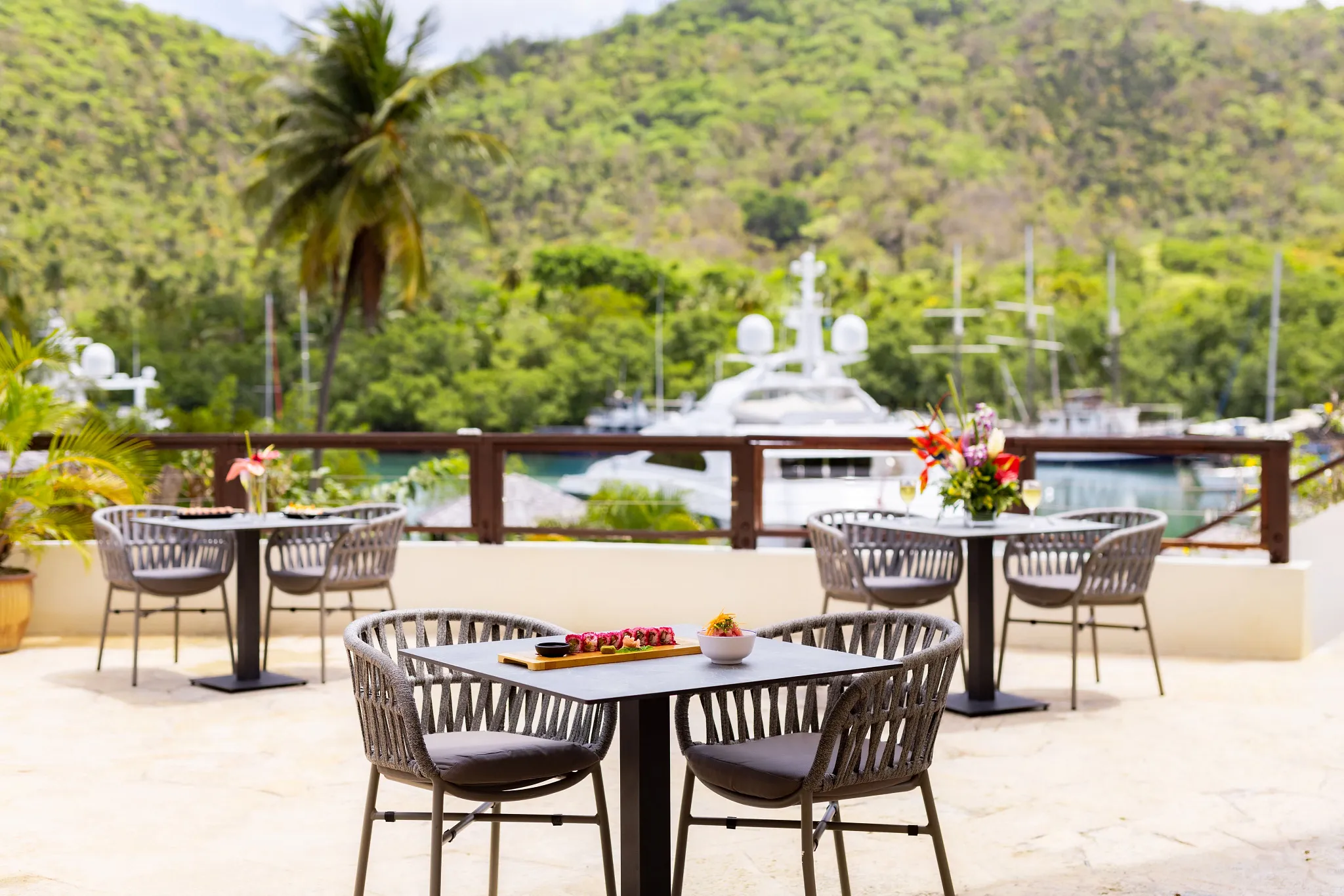 Le Bateau restaurant at Zoëtry Marigot Bay St. Lucia featuring outdoor terrace dining with marina views and Caribbean-inspired cuisine.