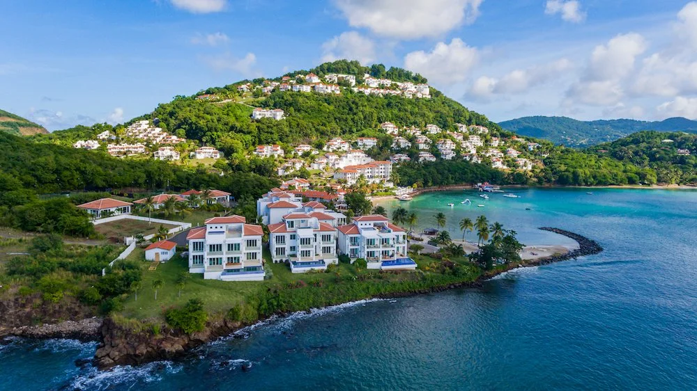 Windjammer Landing Villa Beach Resort St. Lucia hillside villas overlooking the Caribbean Sea with multiple pools and beach access.