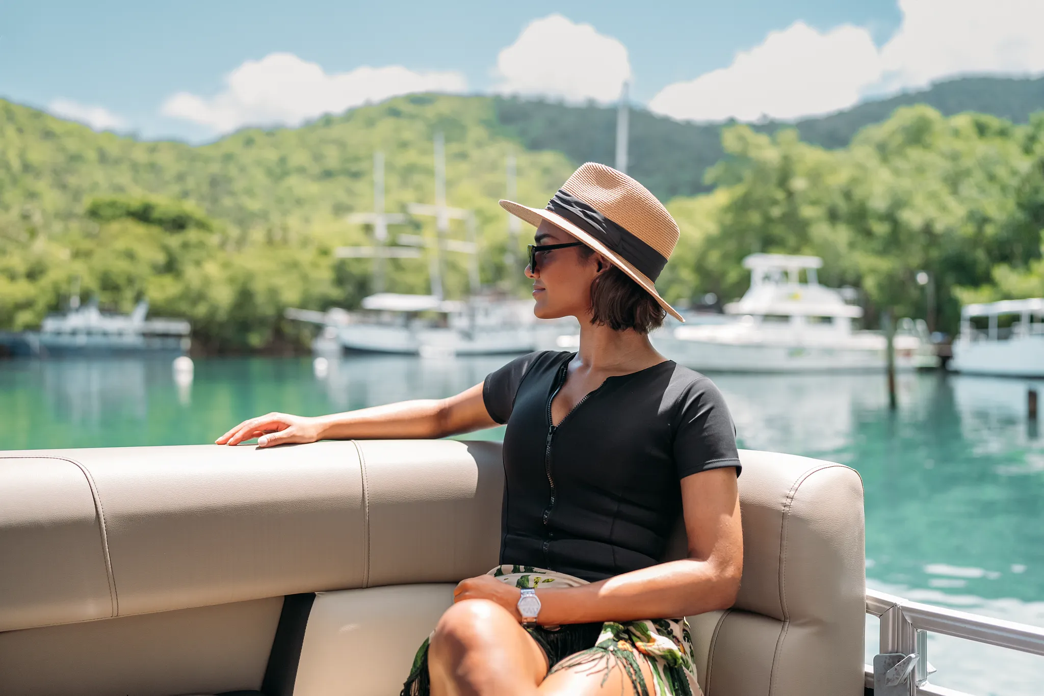 Guest enjoying scenic boat views of Marigot Bay while cruising near Zoëtry Marigot Bay St. Lucia.