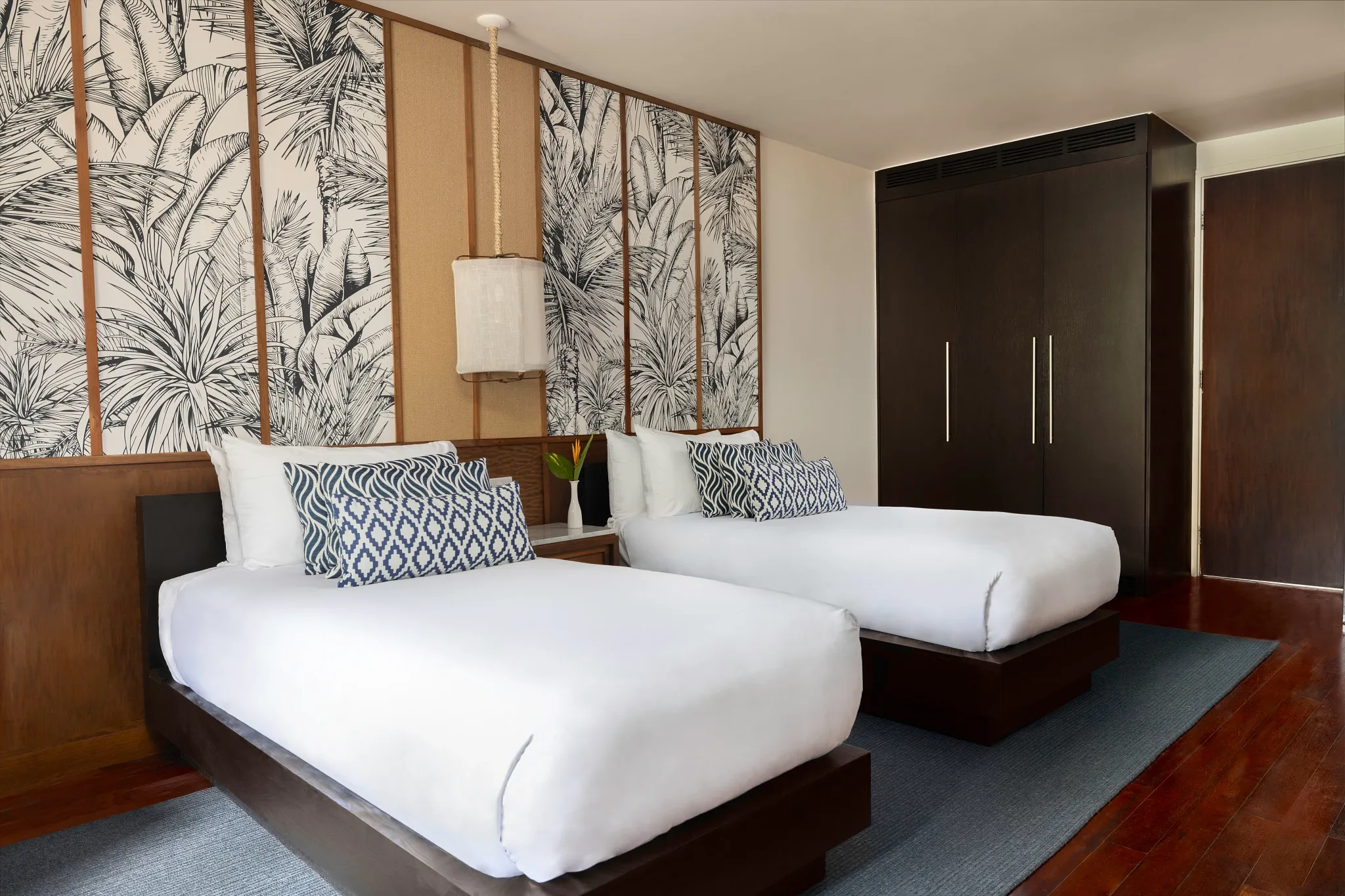 Spacious twin bedroom in Junior Suite Garden View at Zoëtry Marigot Bay.