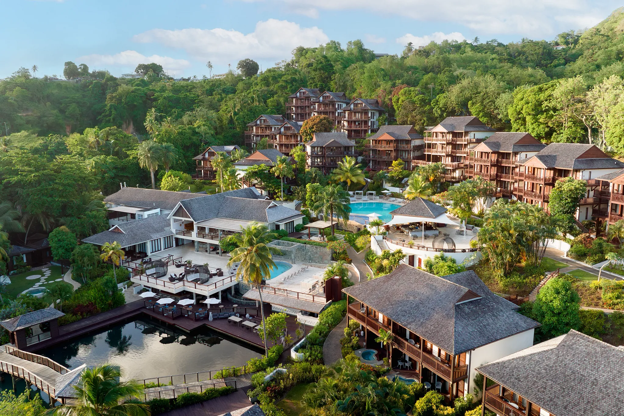 Zoëtry Marigot Bay St. Lucia overlooking calm turquoise waters and hillside villas surrounded by lush greenery.