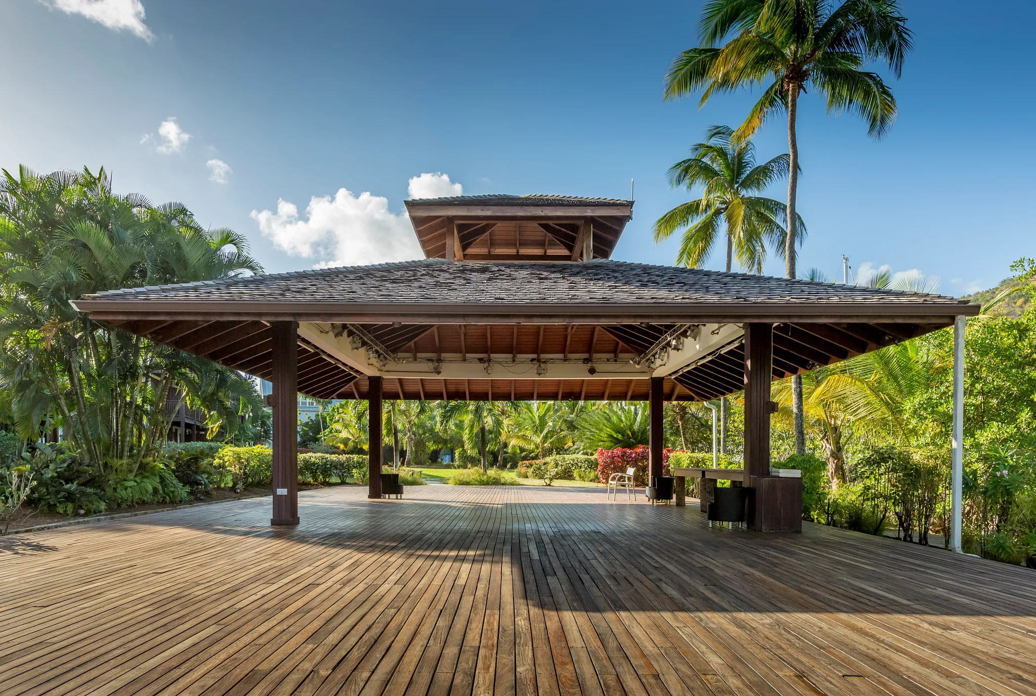 Open-air wooden pavilion surrounded by palm trees at Zoëtry Marigot Bay St. Lucia.