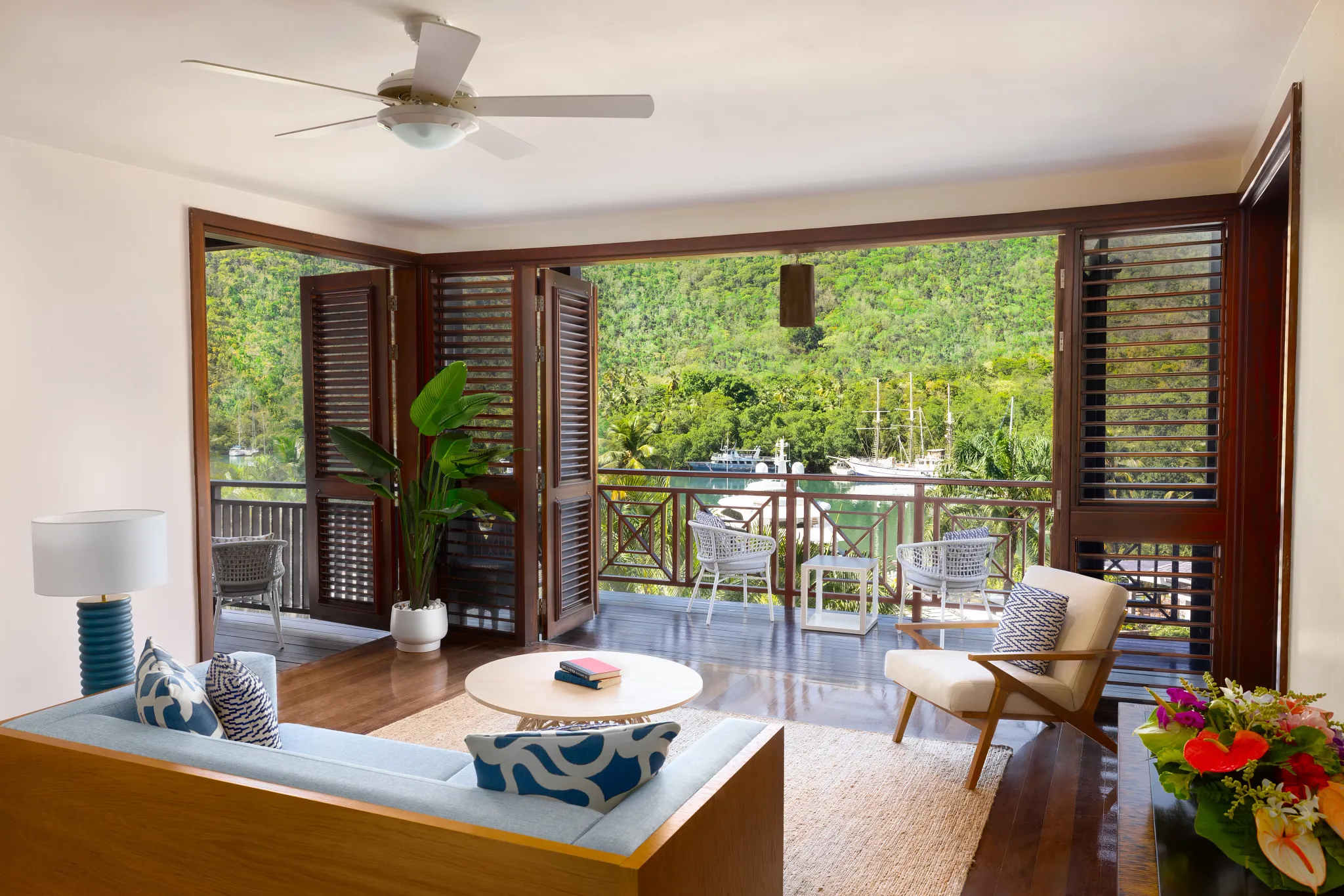 Open living area with balcony views in Penthouse Two Bedroom Residence at Zoëtry Marigot Bay.